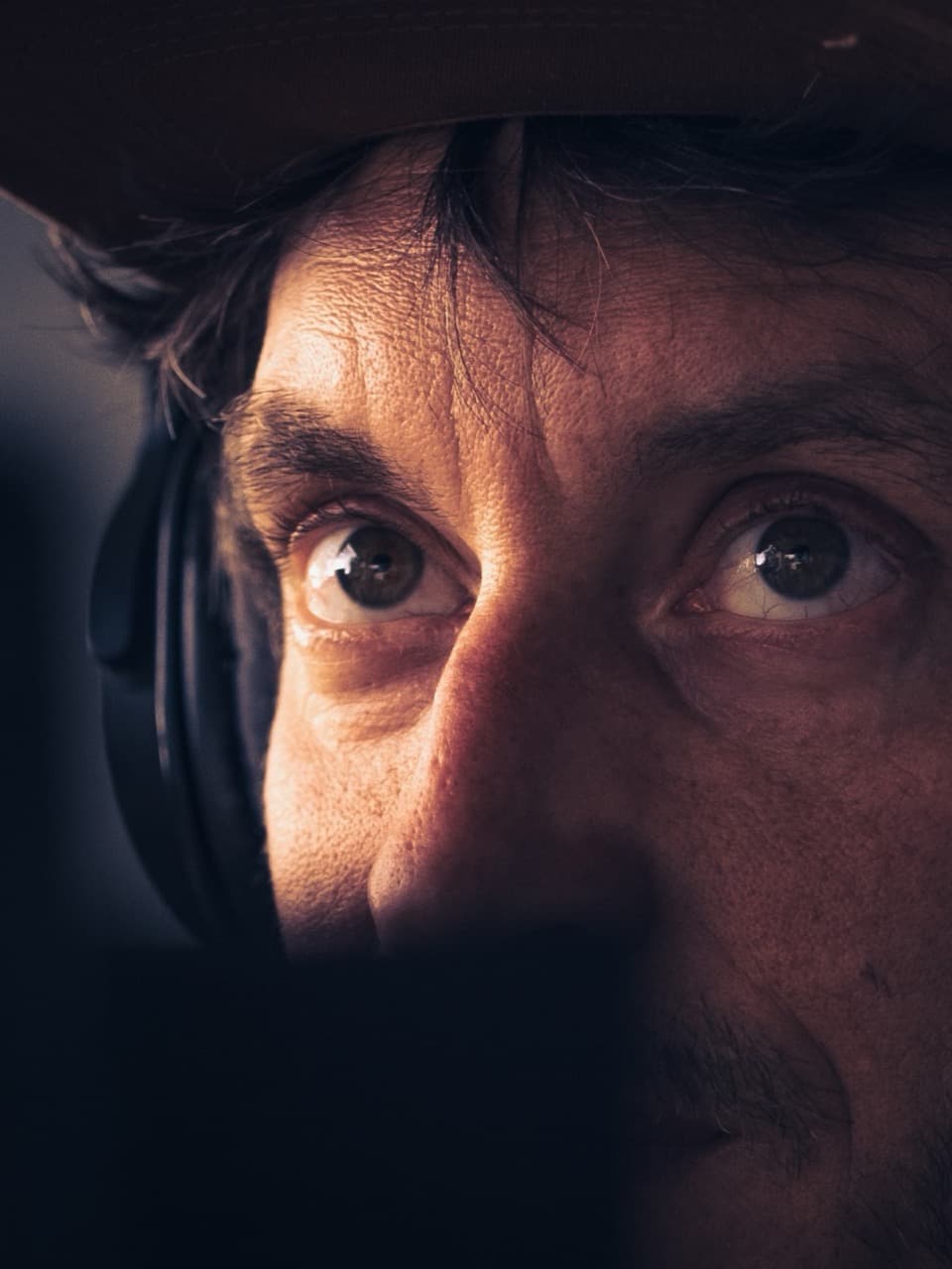 Detailed picture of guy focus wearing headset