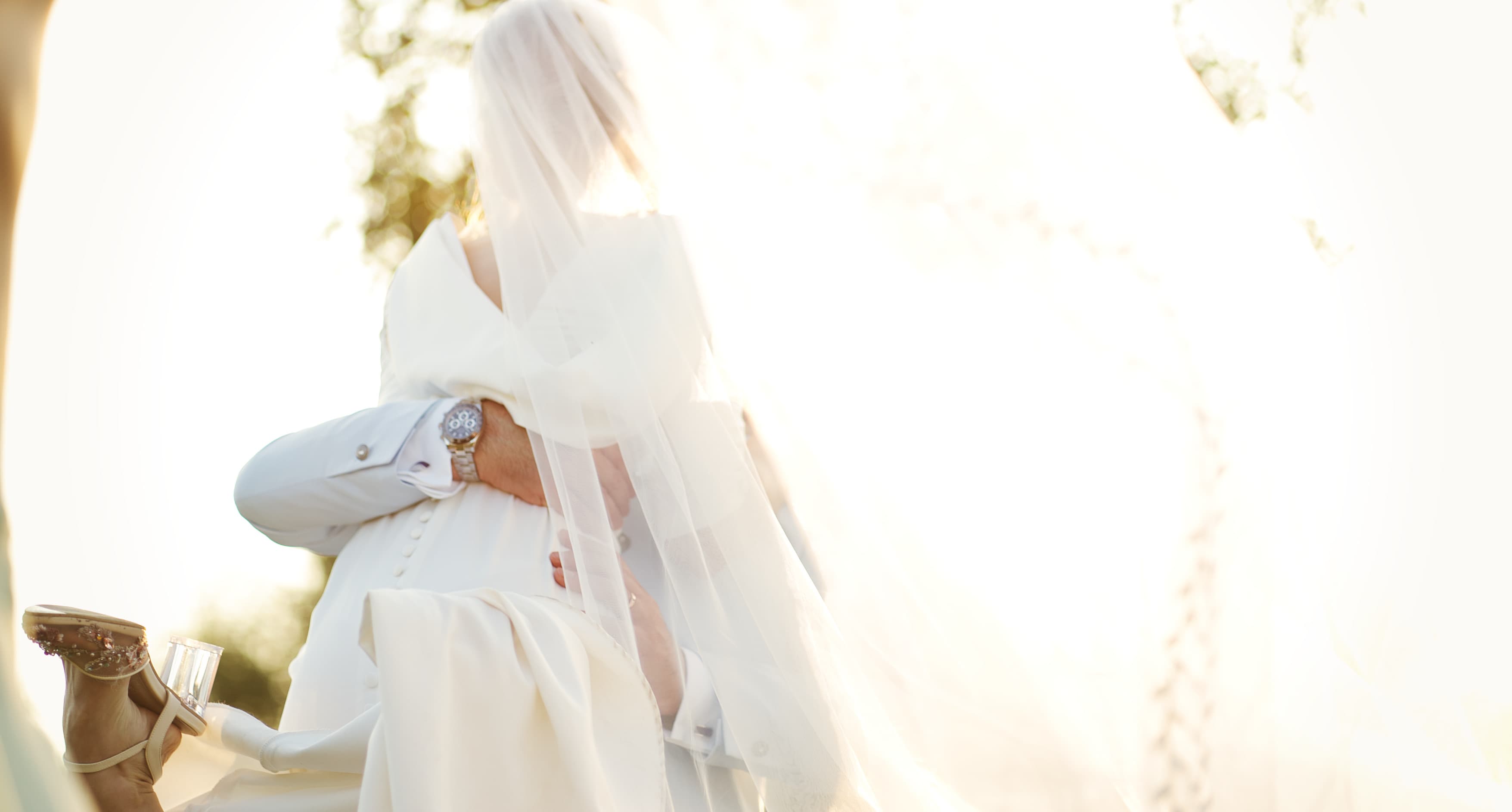 Hugging married couple in Italy at sunset